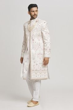 White sherwani with all over floral embroidery. Paired with a pant. - Aza Fashions Bollywood Style Sherwani With Dabka In Traditional Fit, Traditional Fit Sherwani With Resham Embroidery For Festivals, Traditional Fit Sherwani With Intricate Embroidery For Festivals, Fitted White Nehru Jacket With Dupatta, White Sherwani, Full Sleeves, Aza Fashion, Full Sleeve, Floral Embroidery