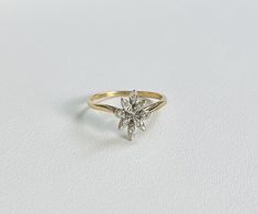 An Antique 14k Gold Flower Style Ring with Diamonds. Stones tested as natural stones.  All items are XRay and Acid tested to ensure metal authenticity. All pieces in this store are solid gold in the purity listed unless otherwise stated.  Weight: 1.4 grams Ring Size: 4.75 (resizing available upon request) Band Width: 1.1mm Art Ring, Flower Style, Gold Flower, Flower Fashion, Gold Flowers, X Ray, Rings Statement, Statement Rings, Natural Stones