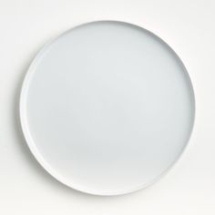 an empty white plate on a white surface