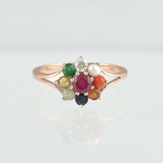 Product :- Ring Metal :- 14k Rose Gold Gold Weight :-  2.17 Gms Diamond color/clarity :-   I-J / SI1 Diamond Weight :- 0.069 Cts Gemstone :-  Ruby, Coral,Pearl, Emerald, Catseye, sapphire, Hessonite Gemstone Weight :- 0.95 Cts Gemstone size  - 2.5mm Round Ring Size as you required  Customization / Replacements  It's easy to create jewellry that's perfect for you. Change the materials to suit your style and budget: Ruby, Emerald, Blue Sapphire, Amethyst, Topaz, Garnet, Peridot, etc. I am happy to Pearl And Gemstone Ring, Navaratna Ring, Navaratna Ring For Women, Ruby Bands, Gemstone Diamond Ring, Wedding Engagement Gifts, Coral Ring, Fancy Gifts, Etsy Wedding Rings