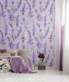 a bed room with a neatly made bed and purple wallpaper