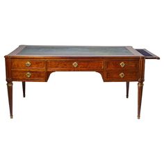 an antique desk with two drawers on each side