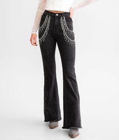 Blue B Ultra High Rise Rhinestone Fringe Flare Stretch Jean - Blue Medium/Long, Women's Washedblack Ultra high rise Inseam measures 33 Slim through the hip and thigh 20 flared bottom opening Frayed hem details. This quality denim is hand-finished for a unique look. It will wear like your favorite jeans, with each hole and tear continuing to destruct over time. You will love the comfort of this denim that has the look and feel of years of wear. . 75% Cotton 20% Polyester 3.5% Viscose 1.5% Spandex Rhinestone Fringe Jeans, Rave Fits, Fringe Jeans, Denim And Diamonds, High Waisted Black Jeans, Rhinestone Fringe, Denim Cargo Pants, Low Rise Flare Jeans, Fashion Bug