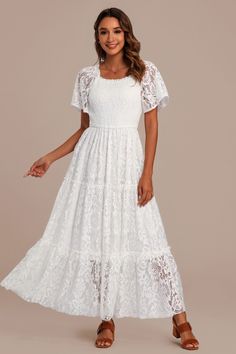 Off White Lace Square Neck Short Sleeve Smocked Tiered Maxi Dress Modest Bridal Shower Dresses, Elegant Tiered Lace Dress With Lace Patchwork, Elegant Tiered Lace Dress With Patchwork, Flowy Lace Dress For Garden Party, Flowy Lace Dress With Lace Sleeves, Flowy Lace Dress With Ruffles, Elegant Tiered Lace Wedding Dress, Flowy Lace Dress With Lace Trim For Garden Party, Flowy Lace Dress With Lace Trim