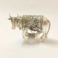 Name of product: 925 Sterling Silver Cow With Calf Idol Metal: 925 Pure sterling silver SMALL Weight: 51grams. Height: 4 centimeters. Width: 5.5 centimeters. Shipping: Standard Shipping Shipping Processing Time: 1 to 3 Days LARGE Weight: 89 grams. Height: 5 centimeters. Width: 7.5 centimeters Shipping: Free Express Shipping Delivery Time: 4 to 7 Days Shipping Processing Time: 1 to 3 Days EXTRA LARGE Weight: 142.50 grams. Height: 6.5 centimeters. Width: 9 centimeters Shipping: Free Express Shippi Bhagwan Shiva, Cow With Calf, Kamdhenu Cow, Calf Cow, Cow And Calf, 22k Gold Bangles, Pooja Items, Silver Pooja Items, Cow Calf