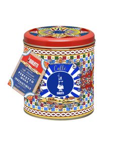 a colorful tin with an ornate design on the lid and label in front of it