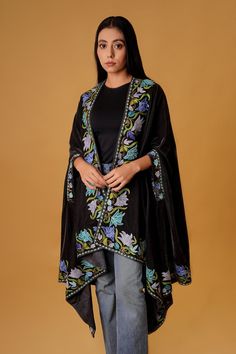 "Complement your outfit with this Royal Velvet Cape. This is a very easy to style cape and it can be paired with any top, blouse, dress, or any other thing, no doubt you'll stand out from the crowd. Product Details Condition Brand New Velvet Cape with Floral Kashmir Aari Embroidery. Colour: Black Size: 82\" X 35\" (208.28 cms X 88.9 cms) approx. One Size Fits All If you want a bigger or smaller size (dimensions), we can make it for you on order, just drop us a message. Care Instructions - Dry Cl Festive Cape-shaped Dupatta With Resham Embroidery, Festive Cape Dupatta With Zari Work, Festive Cape Dupatta With Resham Embroidery, Festive Cape Shape Dupatta With Resham Embroidery, Festive Resham Embroidery Cape Dupatta, Wedding Cape Dupatta For Eid, Wedding Dupatta With Zari Work In Cape Shape, Traditional Cape Style Dupatta For Wedding, Traditional Cape Dupatta For Wedding