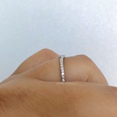 M A T E R I A L S ~ Solid Sterling Silver with Rhodium plated to protect from natural silver oxidation ~ 14k Solid White Gold S T O N E S ~ Simulated Diamond (on Silver) ~ Natural Diamonds (on 14k) ~ Total Stones : 0.10 total D I M E N S I O N S ~ Band: 1.5mm R I N G C A R E ~ Simple instructions to care for the ring is not expose your jewelry to chemicals like bleach, chlorine, hairspray, to avoid chemical reactions or breakdown of materials. (Just as you would with any jewelry) ~ Try not wear Minimalist Diamond White Eternity Band, Minimalist Open Band Jewelry With Prong Setting, Minimalist Cubic Zirconia Eternity Band, Silver Minimalist Stackable Half Eternity Rings, Minimalist Silver Stackable Rings With Half Eternity Detail, Minimalist Stackable Promise Eternity Band, Minimalist Sterling Silver Round Band Eternity Ring, Minimalist Sterling Silver Round Eternity Band, Minimalist Half Eternity Band For Promise