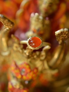 The fiery orange-red colour of this incredible and aptly named Mexican Fire Opal is reminiscent of glowing embers. I love the intensely saturated natural colour of this stone and the luminescent depth within it. One of a kind, this ring features a hand-forged 18k solid gold ring shank and a buttery 22k yellow gold bezel. Materials: Mexican Fire Opal, 18k and 22k yellow gold Size 7.5 Send me a direct email at hello@lorifrancescutti.com with any questions about this or another piece. Red Gemstone Rings For Ceremonial Occasion, Red Gemstone Ring For Ceremonial Occasions, Ceremonial Red Gemstone Ring, Ceremonial Red Gemstone Jewelry, Hand Forged Red Ruby Ring, Hand Forged Ruby Ring In Red, Red Opal Gemstone Ring For Formal Occasions, Spiritual Red Rings For Wedding, Hand Forged Red Jewelry For Anniversary