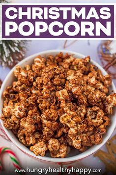 a bowl filled with christmas popcorn on top of a table