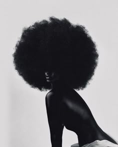 a woman with an afro on her head