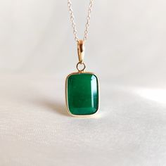 This stunning pendant is set in 14k Solid Yellow Gold with Natural Emerald with utmost precision. It is an unique gemstone pendant for nearly every occasion and is completely hassle-free jewelry. 🔷ABOUT GEMSTONE:  Emerald is often associated with love and romantic relationships. It is believed to promote love, loyalty, and unity, making it a popular choice for engagement and anniversary jewelry. Emerald is often associated with abundance and financial success. It is believed to attract prosperi 14k Gold Gemstones With Bezel Setting For Gift, Emerald Cut Jewelry With Polished Finish As Gift, Emerald Rectangular Pendant Necklace Gift, Emerald Rectangular Pendant Jewelry Gift, Fine Jewelry Emerald Necklace With Polished Finish As Gift, 14k Gold Square Pendant Jewelry With Gemstone, Fine Jewelry Emerald Necklace With Polished Finish, 14k Gold Square Pendant With Gemstone, Green Rectangular Pendant Jewelry For Anniversary