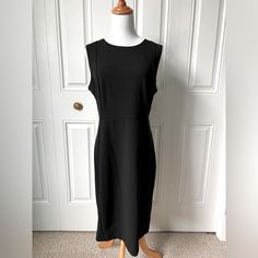 This Is A Sleeveless Black Dress From Calvin Klein. There Is A Gold Zipper Down The Back, About 21” Long. The Overall Length Of The Dress, Shoulder To Hem, Is About 40.5”. Classic Sleeveless Stretch Dress, Classic Sleeveless Midi Dress With Flattering Silhouette, Classic Black Sleeveless Midi Dress, Sleeveless Midi Dress With Flattering Silhouette For Work, Black Sleeveless Dress With Flattering Silhouette, Elegant Sleeveless Calvin Klein Dresses, Black Stretch Sleeveless Dress For Work, Classic Sleeveless Midi Dress For Night Out, Sleeveless Black Dress For Work