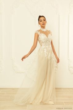 Feel whimsy and chic in our Meadow white bridal ao dai with feminine illusion neckline and back. This gorgeous piece perfectly fuses modern elements with traditional features making it the ideal elegant, unique ao dai. Small cap sleeves and an illusion neckline are oh-so flattering and romantic. We love the couture sequin lace detailing and flowing skirt. Feel like a princess in Meadow! Detail: White Vietnamese Ao Dai Collar: 1.2''/3cm Illusion neckline Illusion back Small cap sleeves Bra cups Wedding Evening Dress With Sheer Back And Fitted Bodice, Wedding Gown With Sheer Back And Fitted Bodice, White Gown With Illusion Neckline For Debutante Ball, Tulle Wedding Dress With Illusion Neckline And Fitted Bodice, Sheer Wedding Evening Dress With Fitted Bodice, Sheer Evening Dress With Fitted Bodice For Wedding, Fitted Wedding Dress With Illusion Neckline For Debutante Ball, Fitted Wedding Dress With Illusion Neckline, Fitted Bridal Dress With Illusion Neckline