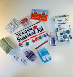 an assortment of school supplies laid out on top of a white surface with the words teacher survival kit written on it