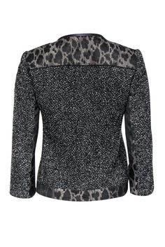 Size 2 Black & Grey Tweed & Leopard Print Jacket Comes w/original tags Retails for $548.00 Shell 70% virgin wool 30% nylon Yoke, center front, under sleeves, hem 43% acetate 33% wool 24% polyester Lining 95% polyester 5% elastane Trim 100% leather Lightly padded shoulders Concealed snap buttons down front Decorative hip pockets Shoulder to shoulder 14.5" Sleeve length 19.75" Bust 34.5" Waist 32" Shoulder to hem 21" Tailored Black Tweed Jacket For Winter, Fitted Black Tweed Jacket For Winter, Black Wool Tweed Jacket For Fall, Leopard Print Jacket, Grey Tweed, Elie Tahari, Print Jacket, Black Grey, Leopard Print