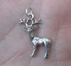 This sterling silver .925 Deer/Fawn Measurements (mm): Length: 22 Width: 10 Height: 1 or (inches): Length: 0.87 Width: 0.39 Height: 0.04 Price is for one at $9.90 Price is for two at $18.00 4th photo shows deer/fawn charm alone. Sterling silver 3D Deer Charm 3 Dimensional. Includes jump ring. Height measured from top to bottom as pictured. Measures:Height:26mm x 17.5 wide(at the widest part) Price is for one deer at $10.15 Price is for 2 deer at $19.95 3rd photo shows 3D deer charm alone Handmade Sterling Silver Charms In Silver, Sterling Silver Charms With Lobster Clasp, Tiny Silver Charms For Gifts, Small-sized Silver Charms For Gifts, Silver Symbolic Dangle Charms, Silver Tiny Round Charm Necklace, Tiny Silver Charm Necklace, Dainty Silver Charms For Jewelry Making, Silver Charms With Lobster Clasp For Gift