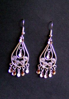 "KARIN - Beautiful hand crafted Traditional Antique Silver Plated Filigree Teardrop Norwegian Solje Style earrings made of silver plated wire, silver plated drops and lovely .925 Sterling Silver or Silver plated earwires or posts Ear Wire Earrings: Earrings measure 2.25 inches long and .75 inches wide on either .925 Sterling Silver or Silver plated ear wires. Post Earrings: Earrings measure 1.75\" long and .75 inches wide on either .925 Sterling Silver or Silver Plated posts All soljes use a var Traditional Silver Drop Jewelry, Ornate Nickel-free Teardrop Dangle Earrings, Ornate Teardrop Nickel-free Chandelier Earrings, Ornate Teardrop Chandelier Earrings Nickel Free, Traditional Handmade Sterling Silver Teardrop Earrings, Handmade Ornate Teardrop Earrings, Traditional Nickel-free Teardrop Chandelier Earrings, Ornate Nickel-free Teardrop Jewelry, Ornate Silver Nickel-free Teardrop Earrings