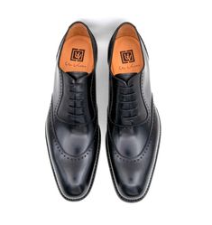 Fitted Lace-up Shoes For Semi-formal Occasions, Elegant Black Wingtip Lace-up Shoes, Elegant Goodyear Welted Wingtip Lace-up Shoes, Luxury Formal Lace-up Shoes With Goodyear Welt, Elegant Goodyear Welted Lace-up Shoes For Business, Elegant Lace-up Goodyear Welted Oxfords, Elegant Business Lace-up Shoes Goodyear Welted, Elegant Business Lace-up Shoes With Goodyear Welting, Elegant Business Lace-up Shoes With Goodyear Welted Construction