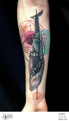 a tattoo on the arm of a person with a cross and globe in the background