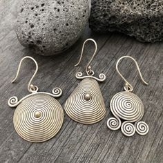 You can choose from 3 unique sterling silver earrings, made with round spiral shapes. 3 Different but unique spiral round silver earrings, perfect for your day by day outfits, easy to match any other accessories. Statement earring that are also light and easy to wear. You can see in one of the pictures there is a number that represents each pair. Pair 1- 2.5cm- 1 inch long 1.8cm- 0.75 inch wide It has a drop length of 4.3cm- 1.75 inch Pair 2- 3cm- 1.25 inch long 2cm- 0.90 inch wide It has a drop Unique Handmade Spiral Earrings, Spiral Single Earring Gift, Spiral Single Earring As Gift, Unique Spiral Earrings, Sterling Silver Spiral Wrap Earring, Spiral Sterling Silver Single Wrap Earring, Sterling Silver Spiral Single Wrap Earring, Unique Spiral Earrings For Gift, Handmade Spiral Sterling Silver Wrap Earrings