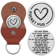 a key chain with two magnets attached to it, one has a heart and the other has a poem