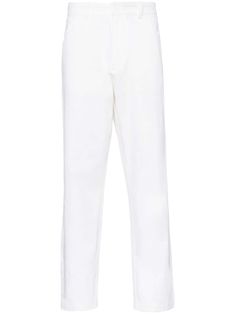 white cotton twill weave enamel triangle logo to the rear belt loops at the waist five-pocket design tapered leg front hook and zip fly fastening Classic White Pants With Five Pockets, White Straight Pants With Belt Loops, White Tapered Leg Chinos For Spring, White Chinos With Straight Hem For Spring, White Chinos For Workwear, Modern White Pants With Five Pockets, White Straight Leg Pants With Belt Loops, Classic White Pants With Belt Loops, Modern White Trousers