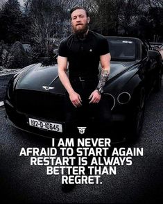 a man sitting on the hood of a black sports car with a quote written below