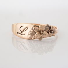 The Stargazer Lily floral ring is a row of dainty flowers wrapped around your fingers. This item is engravable with text or monogram of your choice at no extra cost. The initals are engraved into the underside or on the outside of the ring and embedded in the 3D model for a flawless embossed finish. You are welcome to sketch out your own design too, if you prefer. Please contact me if you would like to customize this ring with different flowers (custom order fees apply). Engraving is available o Lily Rings, Victorian Style Rings, Lily Ring, Dainty Flowers, Sunflower Ring, Stargazer Lily, Engraved Initials, Bee Jewelry, How To Wrap Flowers