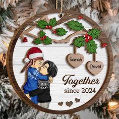 personalized christmas ornament with couple kissing under mistlet and holly wreaths