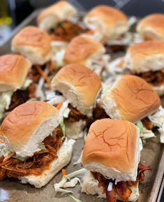 the crockpot bbq chicken sliders are ready to be eaten and served