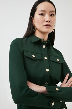 With Its Structured Silhouette And Glossy Gold Rivets, This Jersey Shirt Dress  Promises A Refined Finish. Detailed With An Array Of Utility-Style Patch Pockets, A Buckled Belt And Belted Cuffs, It Blends Soft Tailoring With An Ever-Tasteful Effect. Collared Shirt Dress With Buttoned Pockets For Work, Knee-length Shirt Dress With Buttoned Pockets For Work, Button-up Shirt Dress With Buttoned Pockets For Work, Workwear Midi-length Shirt Dress With Buttoned Pockets, Midi-length Shirt Dress With Buttoned Pockets For Work, Jersey Shirt Dress, Soft Tailoring, Utility Style, Karen Millen