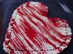 a red and white striped heart on a blue jacket