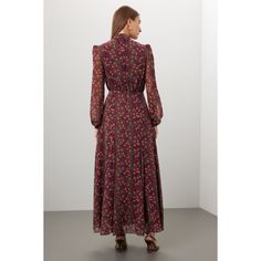 Red floral cotton (100% Silk). Lining (100% Polyester). A-line. Long sleeves. Mock neck. Back zipper closure. 55" from shoulder to hemline. Imported. Elegant A-line Floral Dress For Fall, Feminine A-line Maxi Dress For Fall, Spring Maxi Dress With Stand Collar, Fall Floral Print Dress With Stand Collar, Elegant Red Floral Midi Dress, Red Stand Collar Dress For Spring, Formal A-line Floral Dress, Feminine Red Long Sleeve Maxi Dress, Burgundy Floral Print Dress For Spring