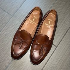 Ralph Lauren Purple Label Loafers In Smooth Burnished Calf Leather Stacked Heel Almond Apron Toe Double Tassels; 360-Degree Lacing Notched Vamp Slip-On Style Lining: Leather Made In Italy Classic Slip-on Dress Shoes With Tassels, Formal Brown Dress Shoes With Tassels, Designer Tassel Loafers With Rubber Sole For Business, Designer Business Tassel Loafers With Brogue Detailing, Classic Leather Moccasins With Tassels, Classic Business Moccasins With Tassels, Classic Leather Business Shoes With Tassels, Classic Tassel Moccasins With Round Toe, Designer Slip-on Tassel Loafers For Business