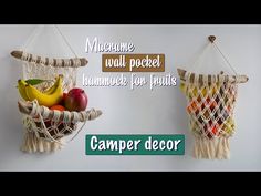 two hanging baskets filled with fruit on top of a white wall next to a sign that says, welcome wall pocket hammock for fruits