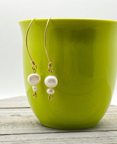 These sweet and delicate Freshwater Pearl earrings are lovely and lightweight! They could be worn to dress up jeans or with a fancy dress. They are hanging from handmade gold filled, wrapped loop earring wires. Message me directly if you would like a pair in Sterling instead of the Gold. Handmade Dangle Pearl Earrings In 14k Gold Filled, Handmade 14k Gold Filled Dangle Pearl Earrings, Handmade 14k Gold-filled Dangle Pearl Earrings, Handmade Everyday Pearl Drop Earrings, Everyday Gold Wire Wrapped Pearl Earrings, Handmade 14k Gold Filled Pearl Earrings For Everyday, Handmade Delicate 14k Gold-filled Pearl Earrings, Delicate Wire Wrapped Earrings For Everyday, Handmade 14k Gold Filled Drop Threader Earrings