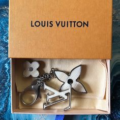 the louis vuitton key chain is in its box