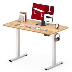 a computer desk with a monitor and keyboard on it