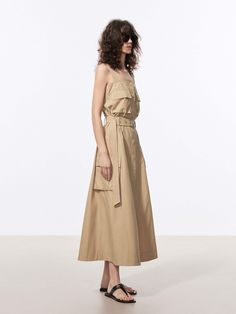 MO&Co. Women's Long Line Cargo Dress Feel stylish and comfortable in our maxi dress. Made from soft cotton fabric, its flowy silhouette and non-adjustable straps provide a flattering fit. With snap multiple cargo pockets and comes with a belt, it's practical and versatile. This style of dress is comfortable and casual, making it a great option for everyday wear or travel. Features : - Long line flowy silhouette- Non-adjustable straps, snap button closure- Multiple cargo pockets, belt included Co Chic Cotton Maxi Dress With Pockets, Beige Maxi Dress With Adjustable Straps For Day Out, Beige Maxi Dress With Tie Straps, Casual Beige Maxi Dress With Tie Straps, Beige Casual Maxi Dress With Tie Straps, Chic Daywear Maxi Dress With Pockets, Chic Midi Dress With Pockets And Spaghetti Straps, Khaki Sleeveless Dress With Pockets, Casual Workwear Dress With Adjustable Straps