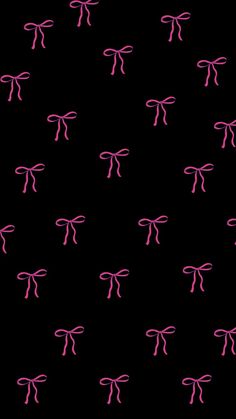 a black background with pink bows on the top and bottom of each bow in different directions