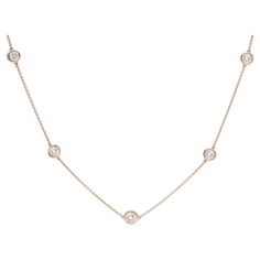 A unique take on a classic style. This 18 karat Rose Gold Diamonds By The Yard Necklace features 5 sparkling white round brilliant cut diamonds expertly bezel set on an adjustable chain. With two loops perfectly situated on the necklace, this beautiful piece can be worn at either 16" or 18" long. With the 5 stones averaging G-H color and VS-SI clarity, the 1.95 carats total weight diamonds provide enough sparkle where this necklace can be dressed up or down. A new necklace featuring all repurpos Rose Gold Diamond Necklace With Bezel Setting, Classic Round Diamond Necklace With Rose Cut Diamonds, Rose Gold Round Cut Diamond Necklace With Bezel Setting, Classic Rose Gold Cubic Zirconia Diamond Necklace, Elegant Station Necklace With Single Cut Diamonds, Luxury Diamond White Necklace With Bezel Setting, Classic Diamond Necklace With Rose Cut Diamonds, Classic Round Rose Gold Diamond Necklace, Classic Rose Gold Round Diamond Necklace