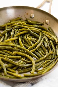 cooked green beans in a frying pan