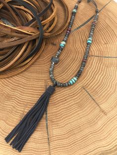 Labradorite, Highlighted with Turquoise & Crazy Lace Agate, Hill Tribe Silver & Leather Necklace, Super soft gray suede tassel.  Overall length 46" including 5.25" Tassel .   * Unless stated otherwise, all earring earring wires, are sterling silver or gold filled. * Please keep in mind that all pieces are hand-crafted with natural materials; as a result, they may have slight variations from the sample picture.    * Because of sanitary reasons, I cannot accept returns or exchanges. However, if an item breaks due to a flaw in the design, please send me a photo of the broken piece, and I will repair, replace or refund depending on the materials available. Adjustable Turquoise Necklace With Natural Stones For Festival, Bohemian Turquoise Necklace As Gift, Adjustable Turquoise Necklace With Natural Stones For Meditation, Rustic Natural Stone Necklaces For Festivals, Artisan Adjustable Turquoise Gemstone Necklace, Bohemian Turquoise Gemstone Necklace, Bohemian Adjustable Black Turquoise Necklace, Adjustable One-of-a-kind Turquoise Necklace For Festivals, Bohemian Turquoise Agate Necklace For Healing