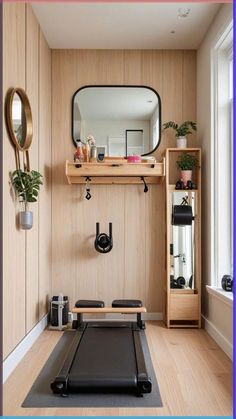 an exercise room with a treadmill and mirror