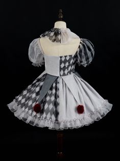 a dress made out of white and black checkered fabric