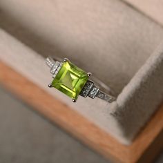 This ring features a 7*7mm square cut peridot and sterling silver finished with rhodium. Customization is available. It is made by hand, and it will take about 7 days to finish the ring after your payment is completed. Any question, just let me know. :) Peridot is August birthstone. My shop homepage: https://www.etsy.com/shop/LuoJewelry?ref=l2-shopheader-name Peridot Engagement Ring, Peridot Engagement Rings, Ring Square, Diamond Promise Rings, August Birthstone, Peridot Ring, Princess Diamond, Square Cut, August Birth Stone