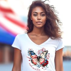 a beautiful young woman with an american flag butterfly on her t - shirt