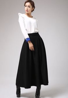 "This black wool skirt designed with pleated front and high fitted waist. Also, two hip pockets and side zip closure for more convenient wear. It is made of soft wool blend and it has lining.the lady skirt with a maxi length is really a good choice for winter. This skirt can be a basic piece in your wardrobe. Due to it classic cut and rich solid color it can be easily matches with many different styles. DETAIL * 30% wool, 30% fiber, 40% polyester * polyester lining * Seam pocket * Right zipper c Black Skirt Maxi, A Line Maxi Skirt, Long Skirt Winter, Maxi Skirt Winter, Long Wool Skirt, Warm Skirts, Fashion Jeans Outfit, Black Wool Skirt, Skirt Winter