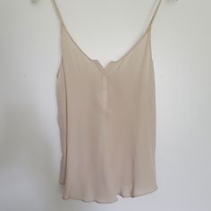 Rory Beca Silk Camisole Blouse Size Xs 100% Silk Best Way To Describe Color Is Beige Or Champagne Or Vanilla. It's Not White Or Ivory. New Without Tags Spring Cream Tank Top With Built-in Bra, Chic Summer Cami Blouse, Chic Cami Blouse For Summer, Chic V-neck Camisole For Day Out, Beige V-neck Camisole With Built-in Bra, Chic V-neck Blouse, Elegant Tank Top With Tank Straps For Day Out, Chic Tank Strap Top For Day Out, Chic Top With Tank Straps For Day Out